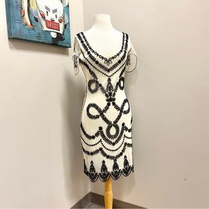 Unique Vintage | Cream 1920s Flapper Dress Black Beading